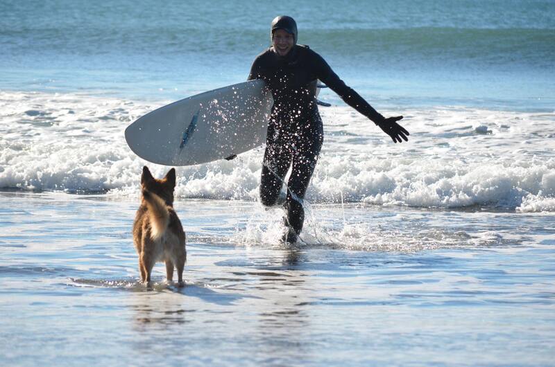 Brian surfing at Short Sands with his dog Ho-D