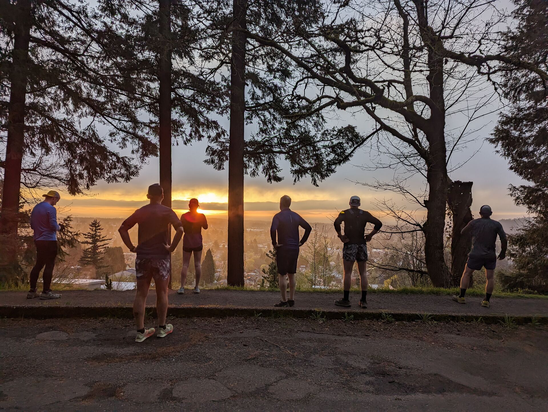 A group watching the sunset from a Mt. Tabor overlook