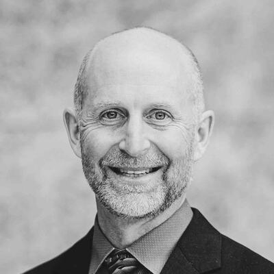 Black-and-white portrait of Chris R., a trail runner