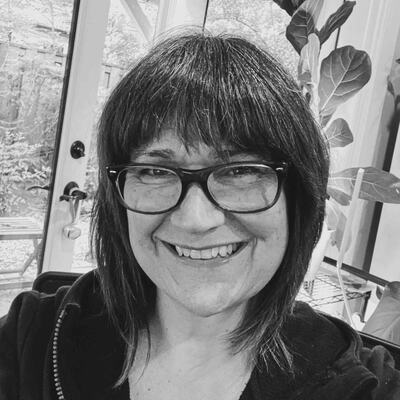 Black-and-white portrait of Deb E., a backpacker